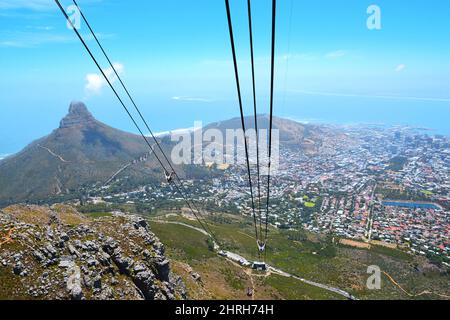 Cape Town, South Africa - January 14, 2019: View from Table Mountain National Park to Lions Head Peak, Cape Town and Robben Island. Under the massive Stock Photo