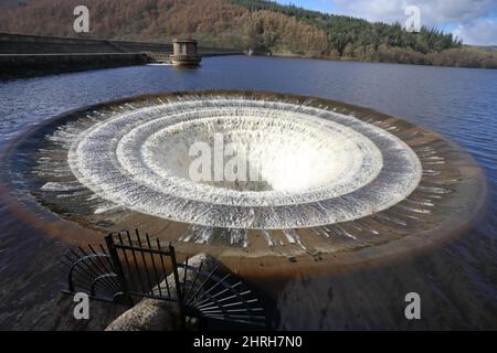 Rt handside (when viewed from the dam) shaft spillway (plug hole) in Ladybower reservoir over flowing after Storms Dudley, Eunice and Franklin, Feb 22 Stock Photo