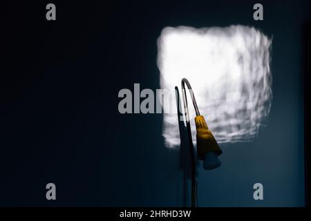 Shot of a yellow lamp under the light from the window with copy space Stock Photo