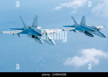 U.S. Navy F/A-18 Super Hornet fighter jets during joint air-to-air training with Hellenic Air Force F-16 Fighting Falcon fighter jets, as a part of Neptune Strike, February 3, 2022 over the Ionian Sea. The NATO exercise is part of recent military moves to deter Russian involvement in Ukraine. Stock Photo