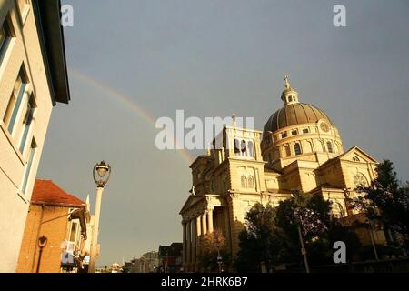 Rainbow in Lincoln Village over the Basilica of St. Josaphat in Milwaukee, Wisconsin. Stock Photo