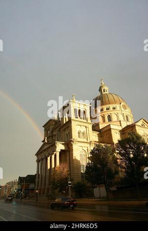 Rainbow in Lincoln Village over the Basilica of St. Josaphat in Milwaukee, Wisconsin. Stock Photo