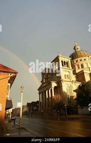Rainbow in Lincoln Village over the Basilica of St. Josaphat in Milwaukee, Wisconsin. Stock Photo