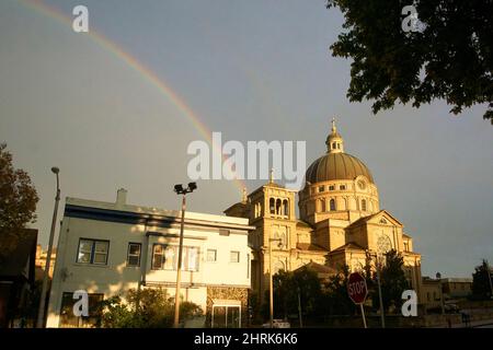 Rainbow in Lincoln Village over the Basilica of St. Josaphat in Milwaukee, Wisconsin. Stock Photo