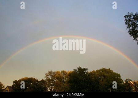 Rainbow in Lincoln Village over the Basilica of St. Josaphat in Milwaukee, Wisconsin. Stock Photo