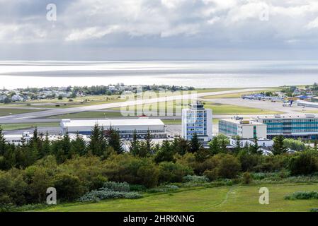 View of a small airport near the coast on a cloudy summer day Stock Photo