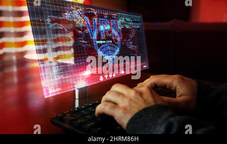 VPN on computer screen. VPN, virtual private network and encrypted link tunnel abstract concept 3d with glitch effect. Man typing keyboard. Stock Photo