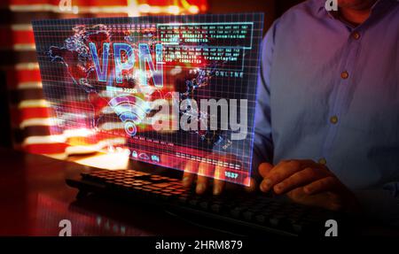 VPN on computer screen. VPN, virtual private network and encrypted link tunnel abstract concept 3d with glitch effect. Man typing keyboard. Stock Photo