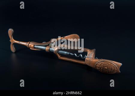 Vintage antique corkscrew on black background Stock Photo