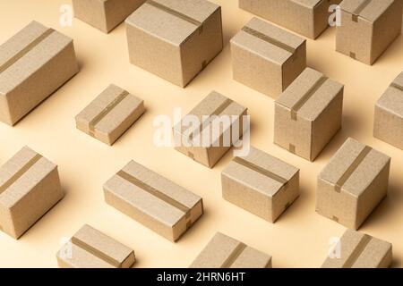 Lots of cardboard boxes pattern on brown background. Stock Photo