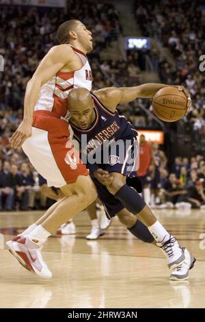 New Jersey Nets' Vince Carter hunkers down as Toronto Raptors' Jalen Rose  keeps an eye on him during third quarter action at the Air Canada Center  April 15, 2005 in Toronto, Canada.