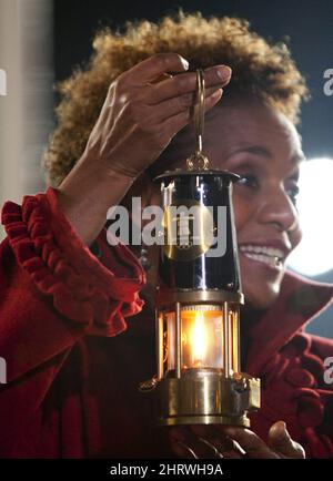 Governor General Michaelle Jean holds the Olympic Flame in a miner's lantern following a Handover Ceremony at the Panathenaic Stadium in Athens, Greece, Thursday, Oct. 29, 2009. The Olympic Flame will now travel over night by plane to Victoria, B.C. and will land in Canada Oct. 30, 2009 to start a 106 day cross Canada torch relay ending in Vancouver for the Opening Ceremonies of the 2010 Winter Olympics in Vancouver. THE CANADIAN PRESS/Jonathan Hayward Stock Photo