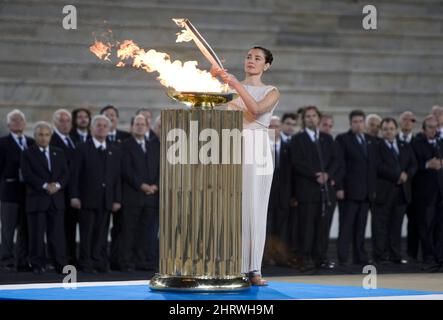Greek actress Maria Nafpliotou, playing a high priestess, lights the Olympic Torch during a Handover Ceremony at the Panathenaic Stadium in Athens, Greece, Thursday, Oct. 29, 2009. The Olympic Flame will now travel over night by plane to Victoria, B.C. and will land in Canada Oct. 30, 2009 to start a 106 day cross Canada torch relay ending in Vancouver for the Opening Ceremonies of the 2010 Winter Olympics in Vancouver. THE CANADIAN PRESS/Jonathan Hayward Stock Photo