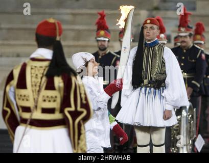 Toronto-born Greek torchbearer Niki Georgiadou carries the Olympic Torch into the Panathenaic Stadium in Athens, Greece, Thursday, Oct. 29, 2009 during an Olympic Flame handover ceremony. The Olympic Flame will now travel over night by plane to Victoria, B.C. and will land in Canada Oct. 30, 2009 to start a 106 day cross Canada torch relay ending in Vancouver for the Opening Ceremonies of the 2010 Winter Olympics in Vancouver. THE CANADIAN PRESS/Jonathan Hayward Stock Photo