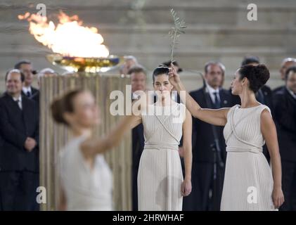 Priestesses dance during a Handover Ceremony of the Olympic Flame at the Panathenaic Stadium in Athens, Greece, Thursday, Oct. 29, 2009. The Olympic Flame will now travel over night by plane to Victoria, B.C. and will land in Canada Oct. 30, 2009 to start a 106 day cross Canada torch relay ending in Vancouver for the Opening Ceremonies of the 2010 Winter Olympics in Vancouver. THE CANADIAN PRESS/Jonathan Hayward Stock Photo