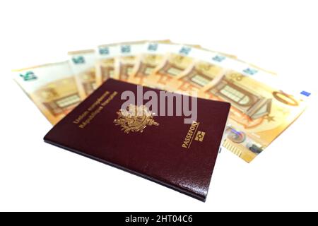 Closeup shot of 50 euro banknotes and French passports isolated on white background Stock Photo