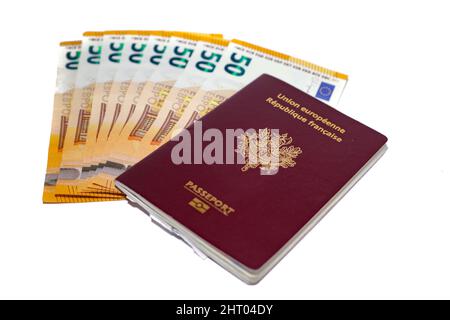 Closeup shot of 50 euro banknotes and French passports isolated on white background Stock Photo