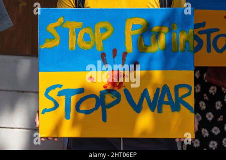 Demonstrators, holding banners and Ukrainian flags, protested Russias intervention in Ukraine in front of the Russian embassy in Bangkok, Thailand, cl Stock Photo