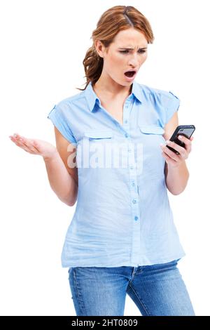 Oh no, she did not just say that. Beautiful young woman looking shocked and offended by a rude text message. Stock Photo