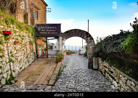 A narrow street among the old stone houses of the oldest district of the city of Caserta. Stock Photo