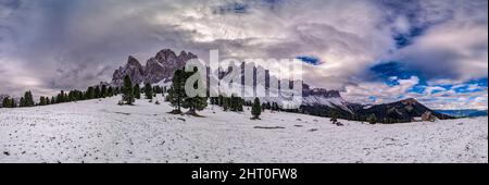 Panoramic view of north faces and summits of Odle group, seen from Malga Geisler after snowfall in autumn. Stock Photo
