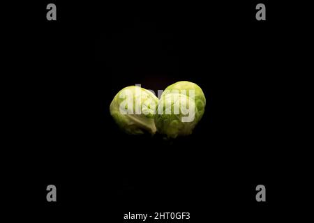 Photo of brussels sprouts isolated on a black background Stock Photo