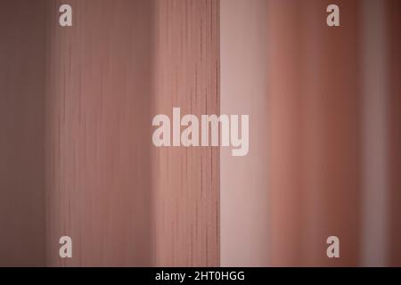 Texture of blinds. Light from window. Blinds on window in room. Pink curtains. Stock Photo