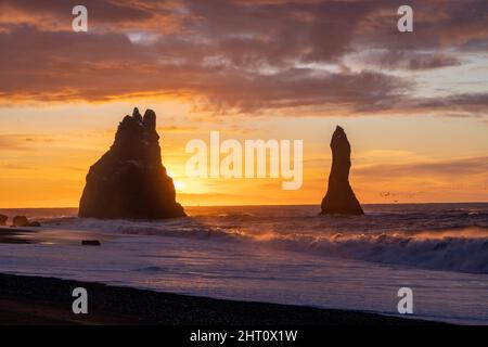 dramatic sunrise over Reynisfjara Black Sand Beach, near village of Vík i Myrdal, south east Iceland Stock Photo