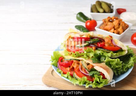 Concept of tasty food with pitas with chicken meat Stock Photo
