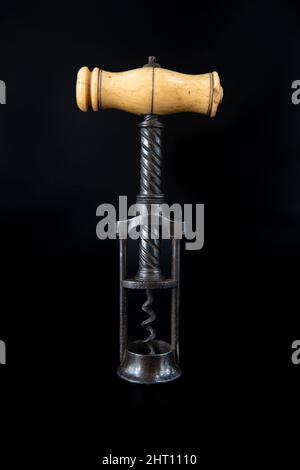 Vintage antique Thomason corkscrew on black background Stock Photo