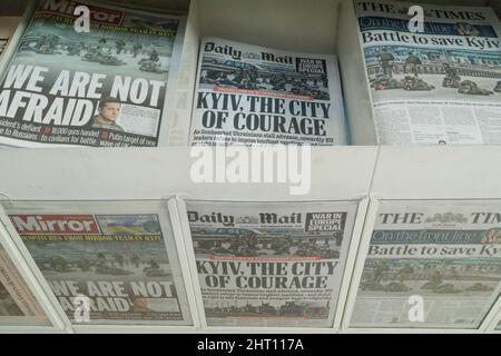 London, UK, 26 February 2022: In a supermarket newspaper rack the front pages of the British national press all display support and sympathy for Ukraine and the Ukrainian people after Vladimir Putin illegally invaded the country on 24 February 2022. The Ukrainian army are trying to defend Kyiv and the Russian have been bombing apartment blocks. Anna Watson/Alamy Live News Stock Photo