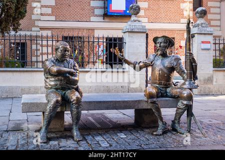 Spain, Dec 2021: Don Quijote and Sancho Panza sculptures in the street of Alcalá de Henares, Spain. Stock Photo