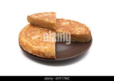 Potato omelette, known as "Spanish omelette". Very consumed in Spain. Isolated on white background. Spanish food concept. Stock Photo