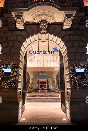 Zurich, Switzerland - December 30, 2021: A night view at the Credit Suisse headquarter building at Paradeplatz in Zurich. Stock Photo