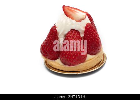 A delicious strawberry and cream cake, in a round shape. Isolated on white background. Stock Photo
