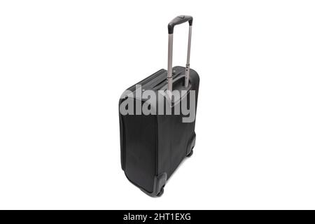 A black trolley bag. Isolated on white background. Vacation concept. Stock Photo