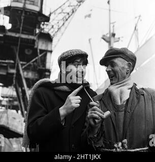 Jimmy Tarbuck enjoys a day out in Liverpool. He is pictured meeting Bernard Taylor,  who works at the Docks.  7th February 1965. Stock Photo