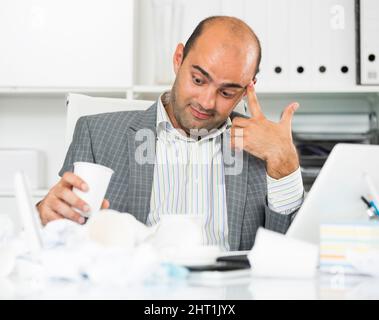 male having lot of work and problems Stock Photo