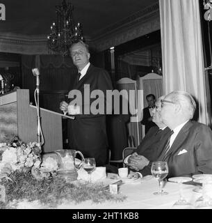 Billy Graham signs copies of his book 'World Aflame' at Foyles Literacy Luncheon held in the Dorchester Ballroom. The event was held in his honour. 30th June 1966. Stock Photo