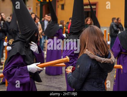 Holy week, procession of the Brotherhood of Crucifixion in Calle Carreteria on holy Monday Stock Photo