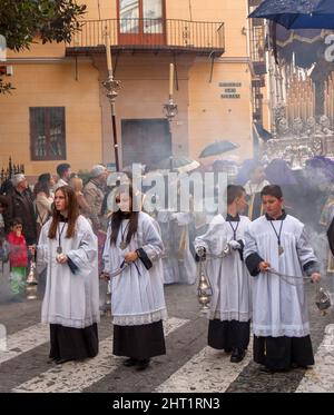 Holy week, procession of the Brotherhood of Crucifixion in Calle Carreteria on holy Monday Stock Photo