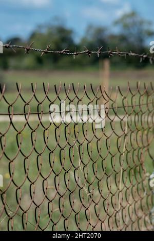 close-up of a fence to divide two pieces of land Stock Photo