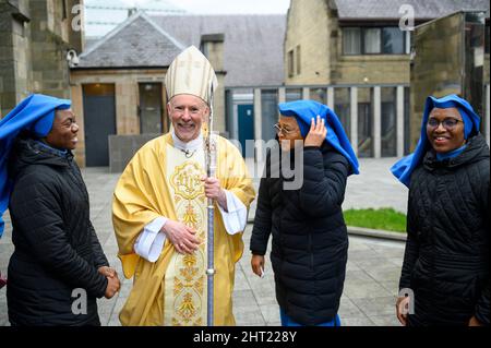 The Most Reverend William Nolan with Nigerian nuns from the Immaculate Heart of Mary Convent in Kilmarnock after he was installed as the new Roman Catholic Archbishop of Glasgow during his enthronement ceremony at St Andrew's Cathedral, Glasgow. Picture date: Saturday February 26, 2022. Stock Photo