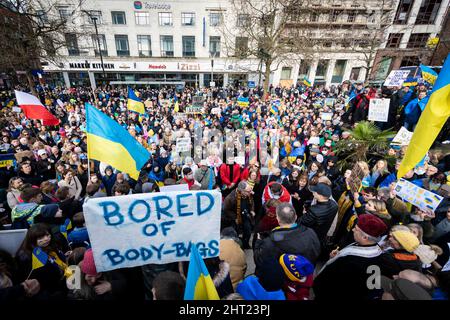 Manchester, UK. 26th Feb, 2022. People attend an anti-war protest at Piccadilly Gardens to stand in solidarity with the people of Ukraine. This comes after Russia launched an attack on Ukrainian territory, after weeks of bitter rhetoric which has now seen hundreds of Ukrainian's die. Credit: Andy Barton/Alamy Live News Stock Photo