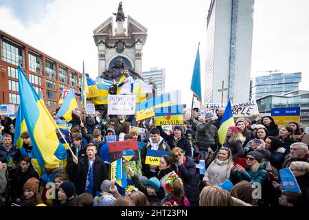Manchester, UK. 26th Feb, 2022. People with placards attend an anti-war protest at Piccadilly Gardens to stand in solidarity with the people of Ukraine. This comes after Russia launched an attack on Ukrainian territory, after weeks of bitter rhetoric which has now seen hundreds of UkrainianÕs die. Credit: Andy Barton/Alamy Live News Stock Photo