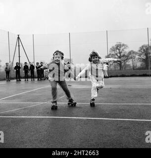 Children at Court Lodge Primary School, Horley, Surrey, will perform their pantomime - The Pied Piper - on roller skates. Their headmistress said 'Roller skating gives them poise and self confidence'. Pictured, the children practising in the playground before the show. 15th December 1966. Stock Photo