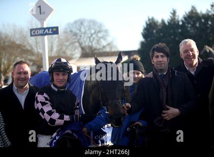 Jockey Jack Tudor (second left) and trainer Christian Williams (second right) pose alongside Cap Du Nord after winning the Coral Trophy Handicap Chase at Kempton Park racecourse. Picture date: Saturday February 26, 2022. Stock Photo
