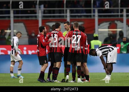 AC Milan players surround the referee  during  AC Milan vs Udinese Calcio, italian soccer Serie A match in Milan, Italy, February 25 2022 Stock Photo