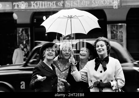 The stars of 'The Killing of Sister George' posing outside the St Martin's Theatre on St Martin's Lane, they are Lally Bowers, Eileen Atkins, Beryl Reid and an unnamed actress. 16th June 1965. Stock Photo