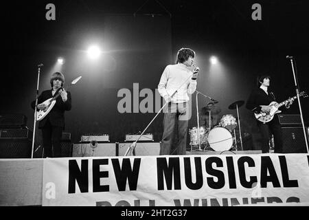 New Musical Express Poll Winners pop concert at Empire Pool Wembley, 1965.The Rolling Stones performing on stage during the concert. Left to right: Brian Jones, singer Mick Jagger, drummer Charlie Watts (mostly hidden) and Keith Richards. The Stones won awards for Best British R & B Group as well as Best New Disc Of The Year for their single (I Can't Get No) Satisfaction. 11th April 1965. Stock Photo